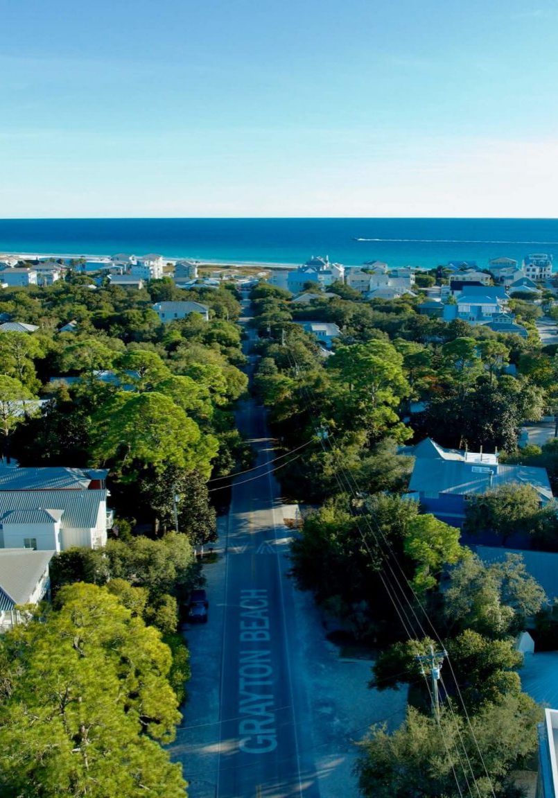 Aerial view of a road marked GRAYTON BEACH leading toward the ocean, professionally captured to represent Grayton Painting.